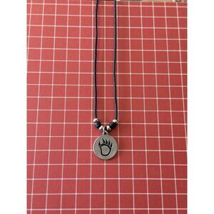 Bearclaw pendant necklace Black corded. Back of pendant is marked Strenght & USA